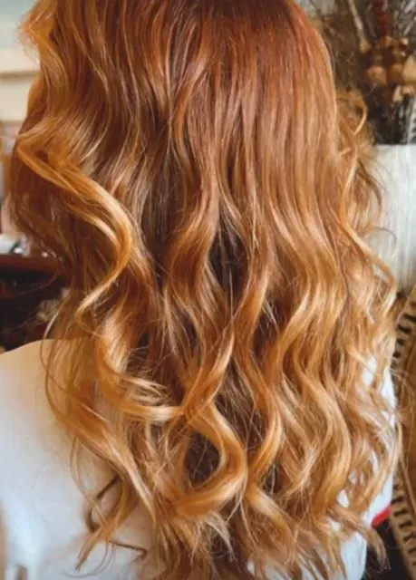 Back view of long golden-copper hair in loose, lived-in waves